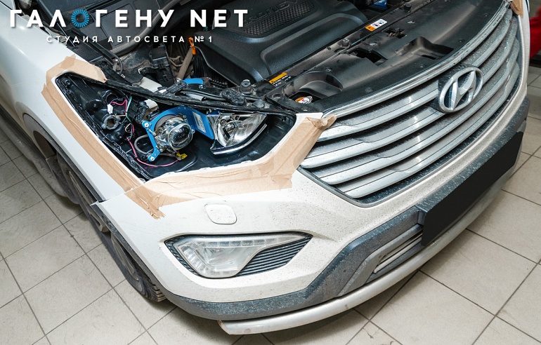 Hyundai Santa Fe III — замена модулей на биксеноновые линзы Hella QR с помощью переходных кронштейнов, полировка и бронирование стекол фар